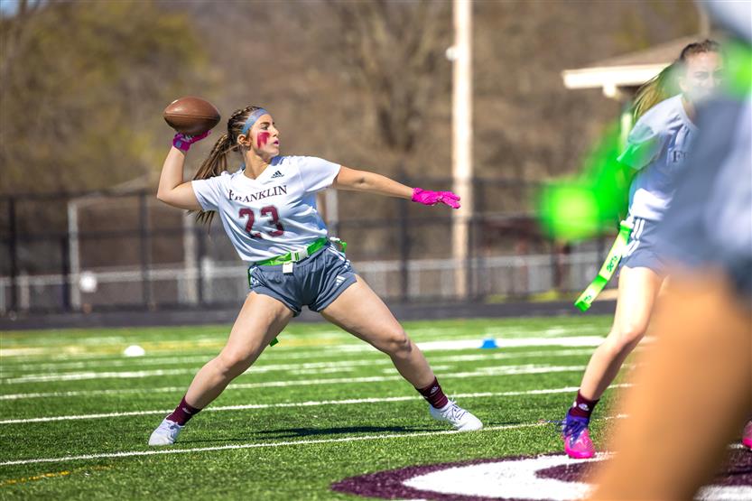 Students play flag football